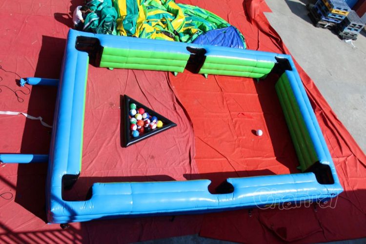 life size pool table with soccer balls