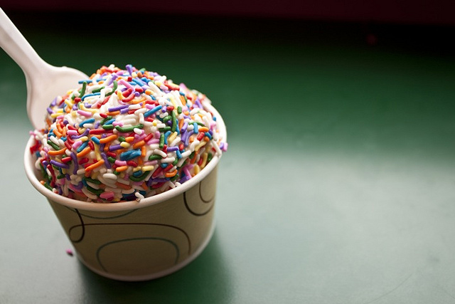 a cup of rainbow ice cream