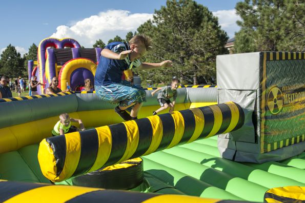 kid jump on inflatable sweeper