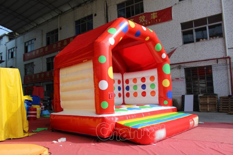 commercial bounce house with twister game