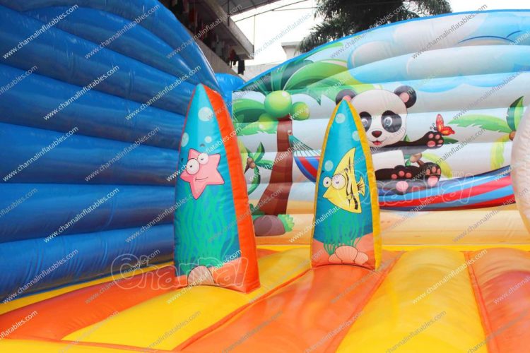 inflatable surfboard obstacle on panda theme jump house