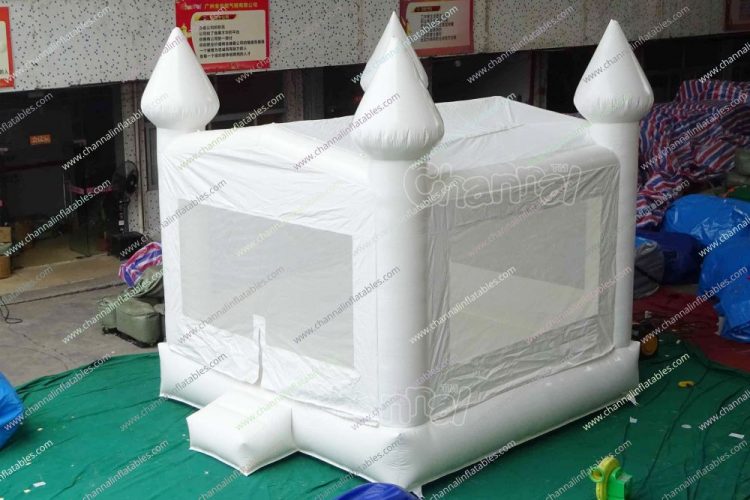 white bounce house for wedding