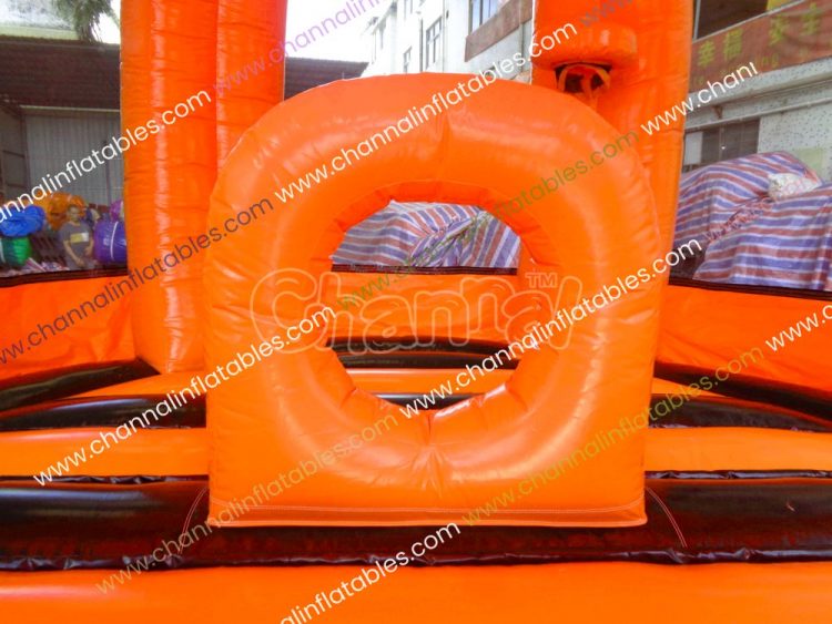 orange inflatable ring obstacle on bouncy house