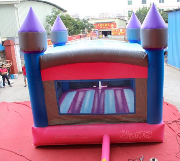 back view of pink blue castle inflatable