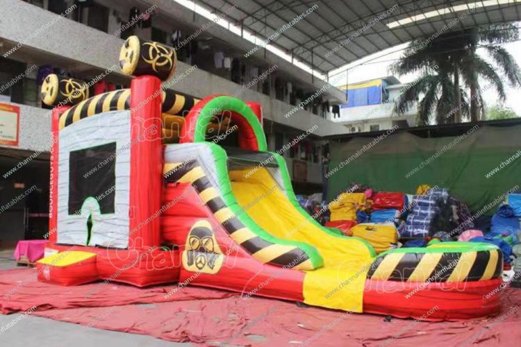 red toxic inflatable combo with water slide