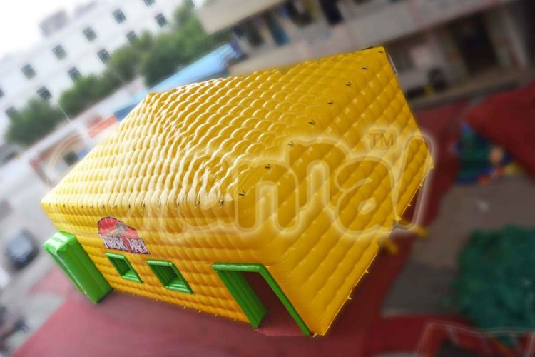 yellow inflatable cube tent