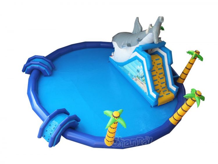 large inflatable water park pool with shark slide