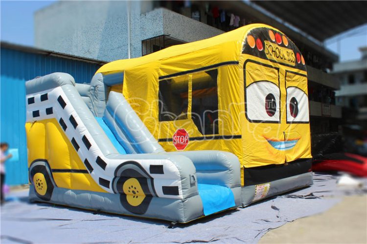 school bus bounce house with slide