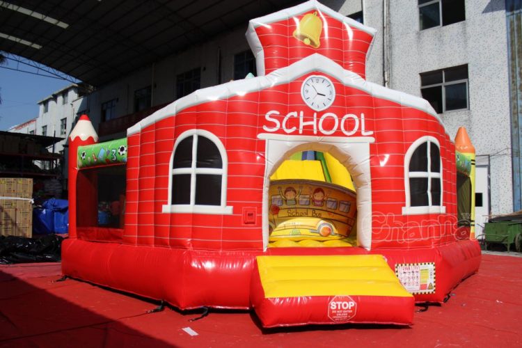 school house inflatable moon bounce