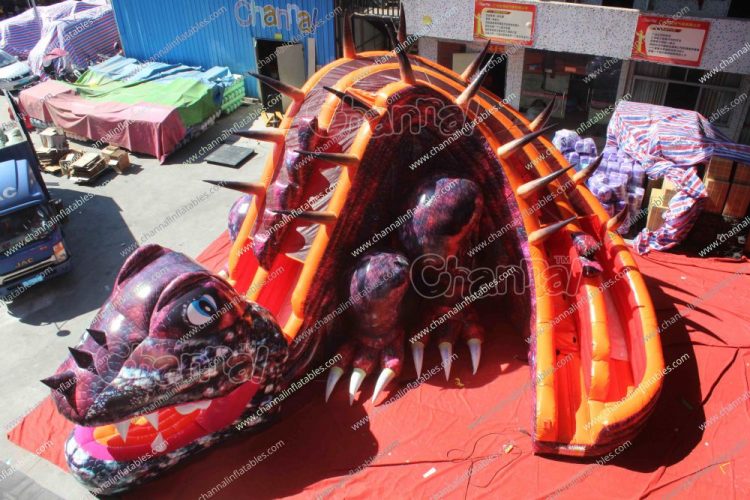 purple dinosaur inflatable slide