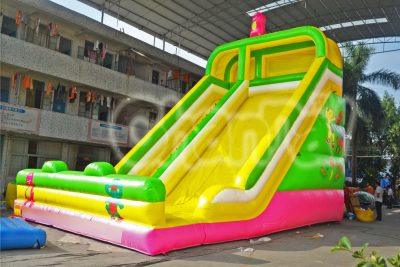 green yellow dino inflatable slide