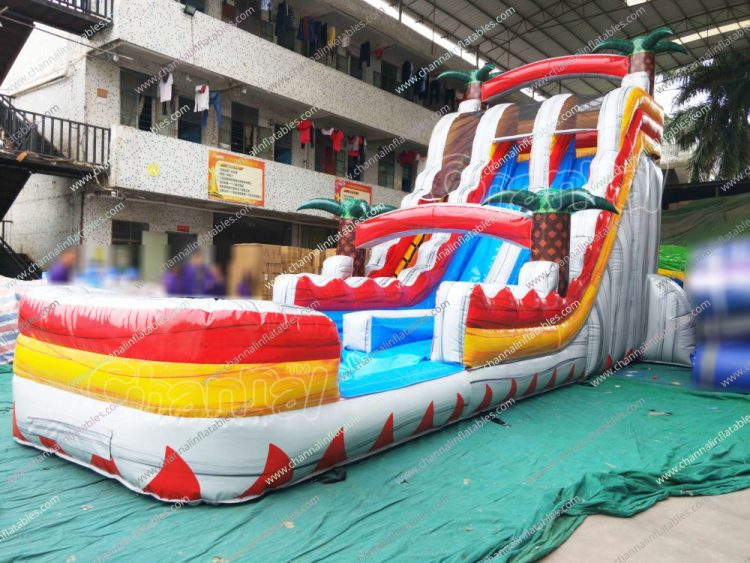 red tropical palm tree water slide