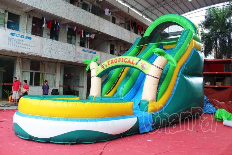 large tropical inflatable water slide with pool